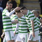 Celtic's James Forrest (centre) is congratulated by his team-mates after his Livingston goal that places him in an exclusive club of 10 players to have netted in 13 consecutive top flight season in the near-50 year Premier era. (Photo by Paul Devlin / SNS Group)