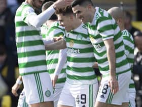 Celtic's James Forrest (centre) is congratulated by his team-mates after his Livingston goal that places him in an exclusive club of 10 players to have netted in 13 consecutive top flight season in the near-50 year Premier era. (Photo by Paul Devlin / SNS Group)