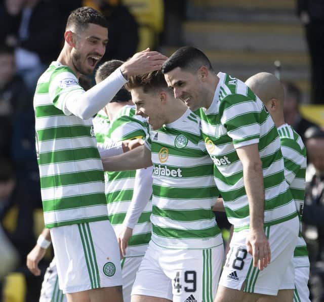 Celtic's James Forrest (centre) is congratulated by his team-mates after his Livingston goal that places him in an exclusive club of 10 players to have netted in 13 consecutive top flight season in the near-50 year Premier era. (Photo by Paul Devlin / SNS Group)