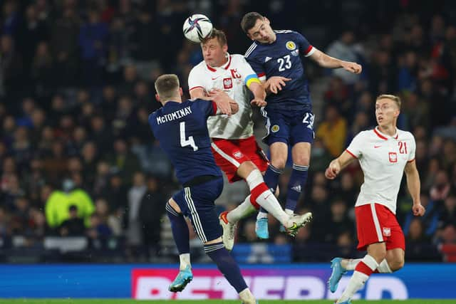 Kenny McLean, right, won his 25th cap for Scotland against Poland.