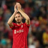 Ben Davies Liverpool applauds the Liverpool fans after appearing in a pre-season match against Osasuna at Anfield last August. (Photo by Lewis Storey/Getty Images)