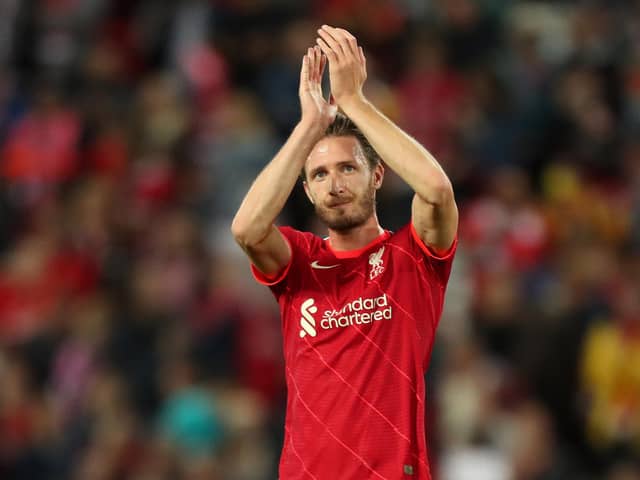 Ben Davies Liverpool applauds the Liverpool fans after appearing in a pre-season match against Osasuna at Anfield last August. (Photo by Lewis Storey/Getty Images)