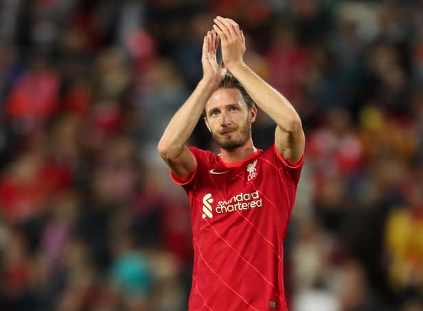 Ben Davies Liverpool applauds the Liverpool fans after appearing in a pre-season match against Osasuna at Anfield last August. (Photo by Lewis Storey/Getty Images)
