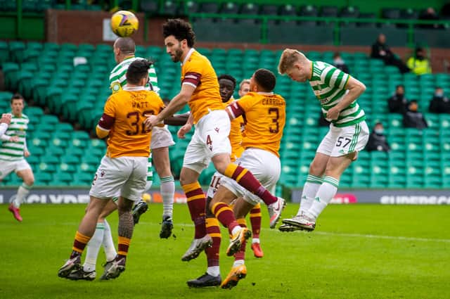 Stephen Welsh, right, powers the ball into the back of the net to give Celtic the lead. Picture: SNS