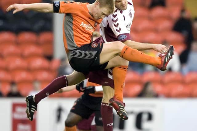 Neilson and Barry Robson do battle during a Hearts v Dundee United match in 2006.