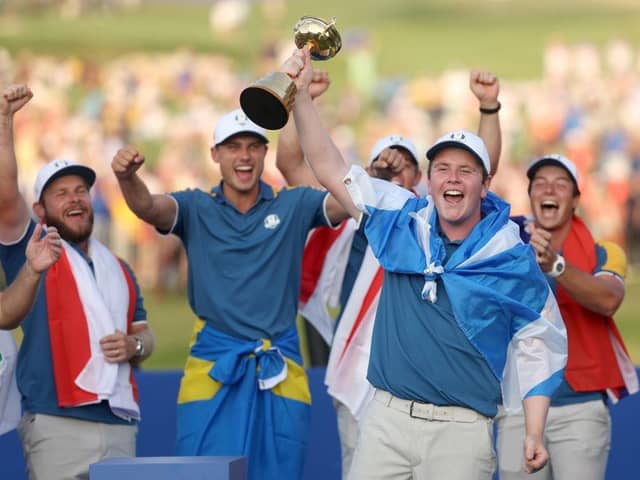 Bob MacIntyre celebrates with  the Ryder Cup trophy following Europe's victory at Marco Simone Golf Club. Picture: Patrick Smith/Getty Images.
