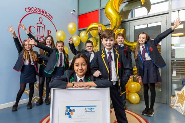 Pupils from Crosshouse Primary School, East Kilbride, celebrate accreditation for good financial education. Picture: Iain McLean