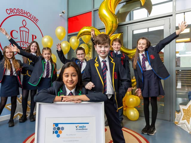 Pupils from Crosshouse Primary School, East Kilbride, celebrate accreditation for good financial education. Picture: Iain McLean