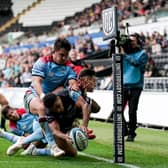Ospreys winger Keelan Giles manages to touch the ball down in the corner for his first try despite the efforts of Glasgow's Sam Johnson and Tom Jordan. (Photo by Robbie Stephenson/INPHO/Shutterstock)