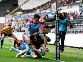 Ospreys winger Keelan Giles manages to touch the ball down in the corner for his first try despite the efforts of Glasgow's Sam Johnson and Tom Jordan. (Photo by Robbie Stephenson/INPHO/Shutterstock)