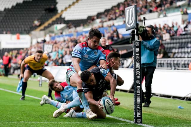 Ospreys winger Keelan Giles manages to touch the ball down in the corner for his first try despite the efforts of Glasgow's Sam Johnson and Tom Jordan. (Photo by Robbie Stephenson/INPHO/Shutterstock)