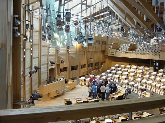 People gather inside the Scottish Parliament