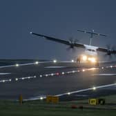 A aircraft lands at Leeds Bradford Airport in high winds during Storm Pia. A yellow weather warning for wind has been issued for parts of Scotland for Christmas Eve. Picture: Danny Lawson/PA Wire