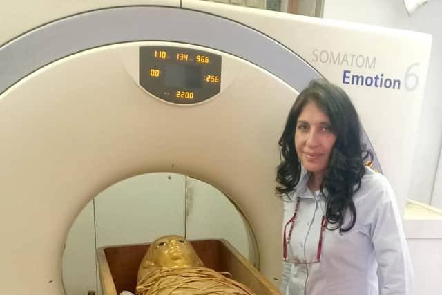 Dr Sahar Saleem, professor of radiology at the Faculty of Medicine at Cairo University and the radiologist of the Egyptian Mummy Project, scanning a wrapped mummy.