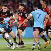 Mosese Tuipulotu, with ball in hand, in action for New South Wales Waratahs against Crusaders. (Photo by Sanka Vidanagama / AFP)