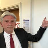 Richard Leonard MSP beside plaque commemorating John Swinney opening Haven Products factory in 2015.