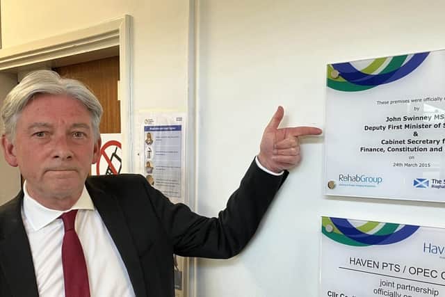 Richard Leonard MSP beside plaque commemorating John Swinney opening Haven Products factory in 2015.