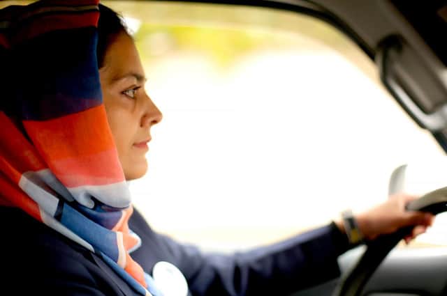 A driver of the Pink Shuttle bus, part of Afghanistan's first all-woman transport network, which received funding from the Linda Norgrove Foundation. Drivers have been alarmed in the recent upsurge in Taliban violence in Kabul but are determined to keep going. PIC: Linda Norgove Foundation.