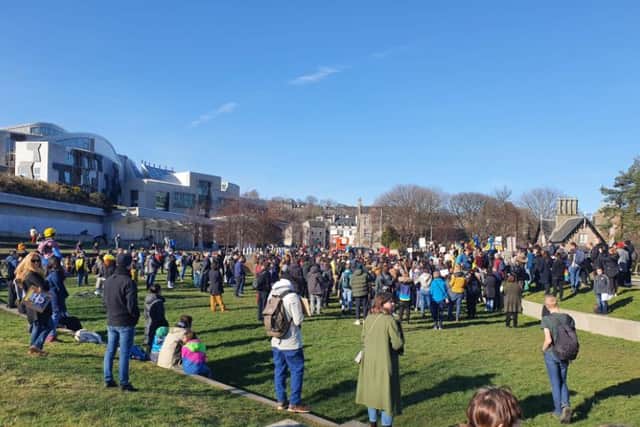 Protesters listen to speeches at Holyrood park.