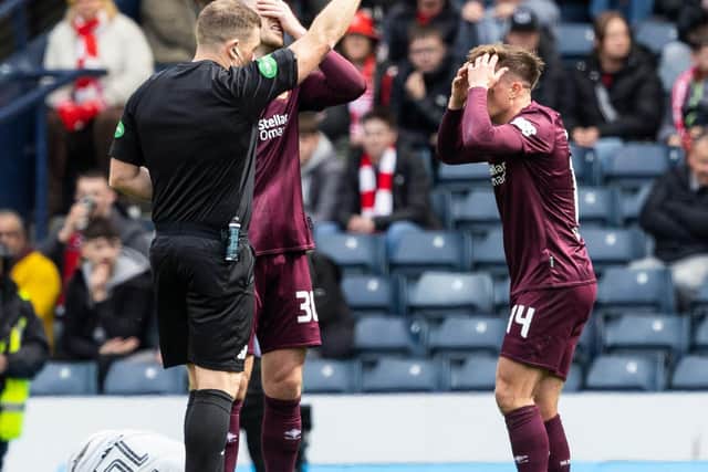 Hearts midfielder Cammy Devlin is shown a second yellow card by referee John Beaton during the Scottish Cup semi-final defeat to Aberdeen at Hampden. (Photo by Mark Scates / SNS Group)
