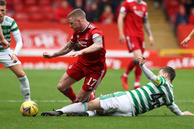 Aberdeen's Jonny Hayes is tackled by Celtic's Callum McGregor in the club's 2-1 defeat on Sunday and believes, in time, they will tackle the desperate form issues scarring the early months of the Stephen Glass era. (Photo by Craig Williamson / SNS Group)