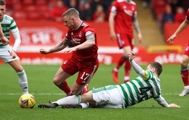Aberdeen's Jonny Hayes is tackled by Celtic's Callum McGregor in the club's 2-1 defeat on Sunday and believes, in time, they will tackle the desperate form issues scarring the early months of the Stephen Glass era. (Photo by Craig Williamson / SNS Group)