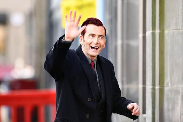 Tennant, who plays Crowley in the fantasy comedy series, waved to locals and fans who had gathered on the street.