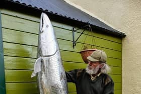 Michel with his sculpture.