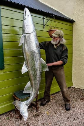 Michel with his sculpture.