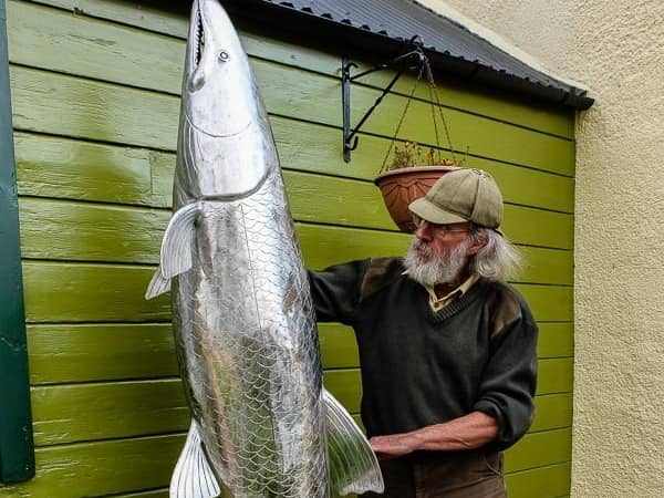 Michel with his sculpture.