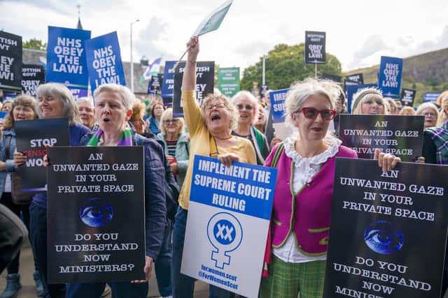 People demonstrate outside the Scottish Parliament earlier this month, calling for the Scottish Government to implement the Supreme Court ruling on gender. Picture: Jane Barlow