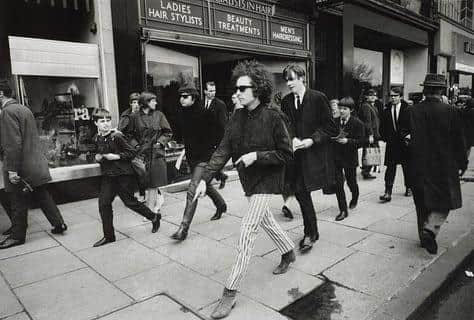 Bob Dylan taking a stroll along Edinburgh's Princes Street in 1966.