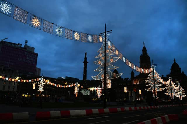 See Christmas lights brighten up George Square for the festive season. Photo: John Devlin.