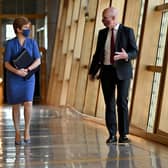 First Minister Nicola Sturgeon and deputy John Swinney walk up a corridor prior to updating MSPs in any changes to coronavirus restrictions. Picture: Jeff J Mitchell-Pool/Getty Images