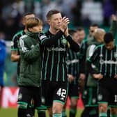 Celtic's Callum McGregor takes the acclaim of the fans at full time.