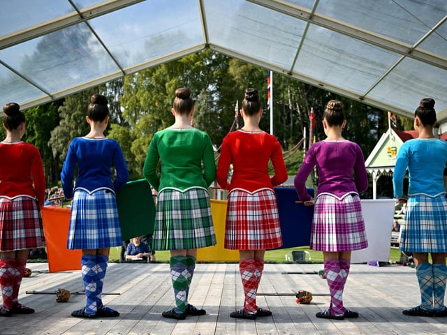 Sword dancers stand in line during the annual Braemar Gathering in Braemar