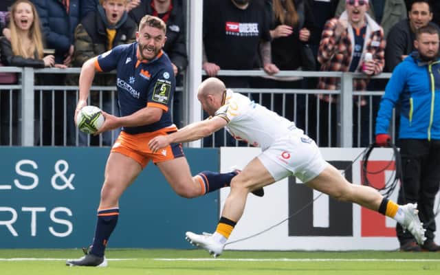 Edinburgh's Adam McBurney is tackled by Wasps' Dan Robson during the Challenge Cup quarter-final at DAM Health Stadium. (Photo by Ross Parker / SNS Group)