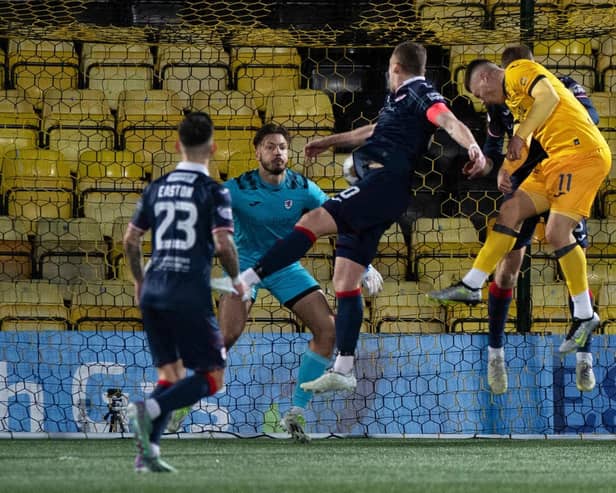 Livingston's Dan Mackay heads home his side's winner against Raith Rovers in the Scottish Cup fourth round.  (Photo by Sammy Turner / SNS Group)