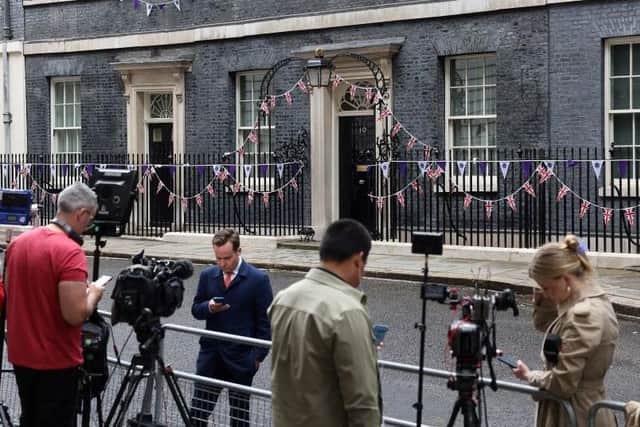 Members of the media outside 10 Downing Street on Monday (Picture: Hollie Adams/AFP)