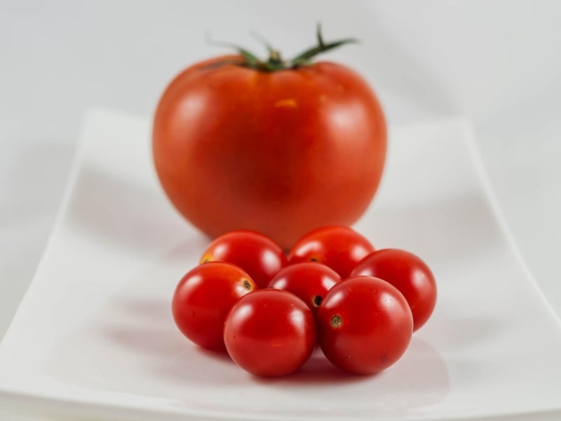 Above you’ve got totie tomatoes but they’re not all totie, as you can see there’s one big one - totie refers to something being small.