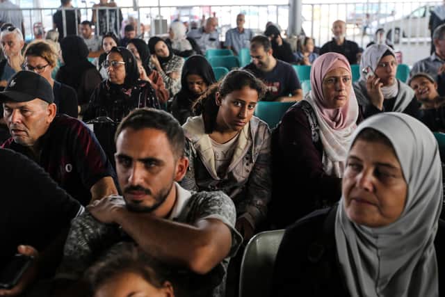 Citizens with foreign passports waiting to travel through the Rafah crossing on Thursday. Amid the horrors of the Israel - Hamas war, Joyce McMillan has found a sense of gratitude for the peaceful life she has been allowed. (Photo by Ahmad Hasaballah/Getty Images)