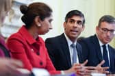 Rishi Sunak and Britain's Home Secretary Suella Braverman attend a policing roundtable summit