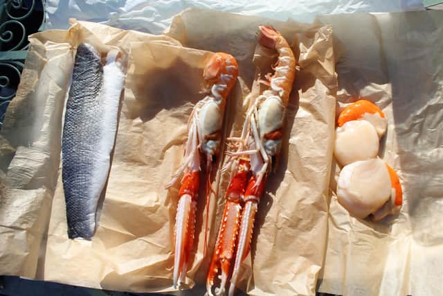 Guests will be sent a list of provisions to order, including a seafood box, which contained freshly caught langoustine, scallops and sea bass .