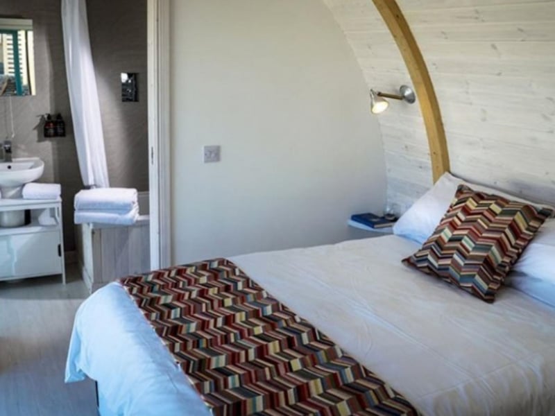 The comfy double bed looks out over the beach.