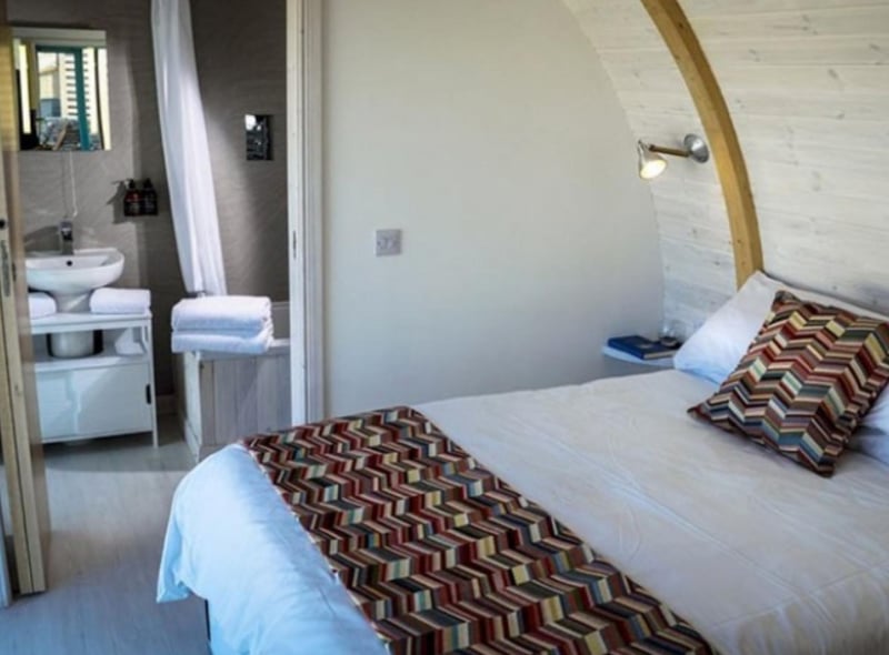 The comfy double bed looks out over the beach.