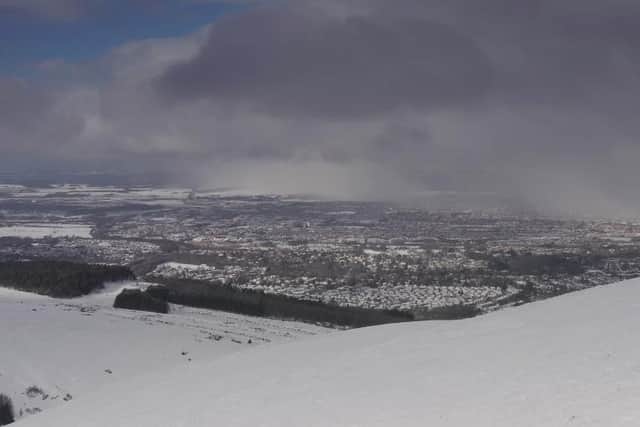 Incredibly rare phenomenon known as a 'Snownado' caught on film above Edinburgh.