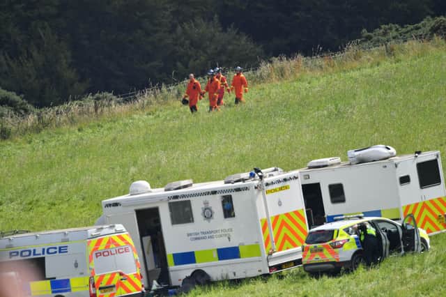 Emergency services at the scene near Stonehaven, Aberdeenshire, following the derailment of the ScotRail train which cost the lives of three people. Ben Birchall/PA Wire