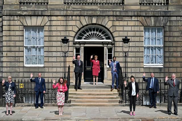 Waving, not drowning... the refreshed Scottish Cabinet greets a new era (Picture: Jeff J Mitchell/Getty)