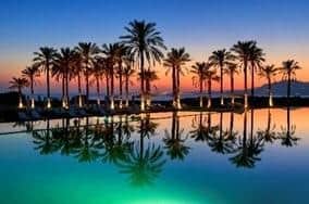 Sunset over the pool at Rocco Forte Hotels Verdura Resort in western Sicily. Pic: J Levy