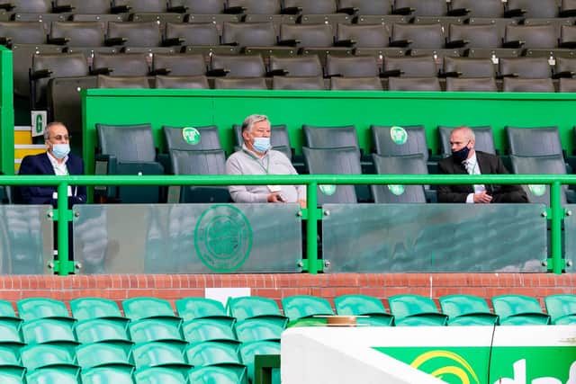 Celtic chief executive Peter Lawwell, pictured (centre) watching the behind closed doors friendly between his club and Ross County last weekend, has welcomed news fans could be allowed back inside stadiums from 14 September.